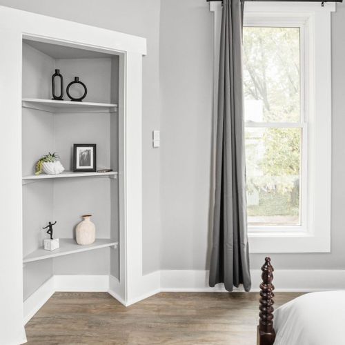 A stylish corner shelf, providing both practical storage and a touch of decorative charm.
