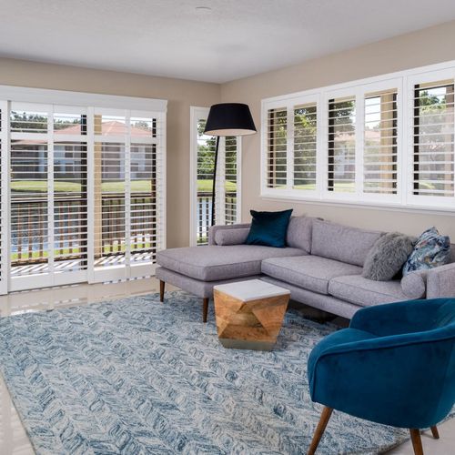 Spectacular golf course and water views from the living room featuring a smart tv
