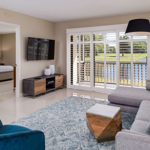 Spectacular golf course and water from the living room featuring a smart tv