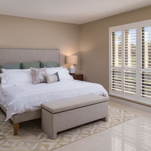 This bedroom features a king size bed with incredible water and golf course views and access to the balcony.