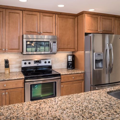 Gourmet kitchen with granite counter tops and stainless steel appliances
