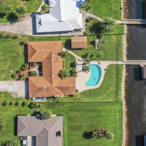 Overhead view of the property and backyard dock