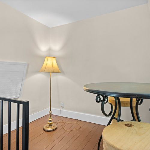 TOWER - HOUSE: The third floor tower is small, but there is a table and chairs along with a lamp provided for guest usage