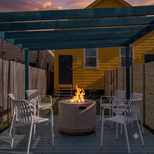 Shaded outdoor patio w/ a dining table — great for al fresco meals or morning coffee.