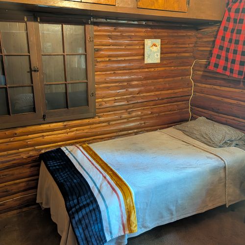 BEDROOM #2:  Features 2 twin size beds, nightstand, lamp, closet, dresser, and luggage stand