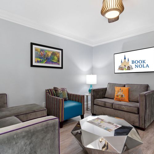 Cheerful sitting room w/ colorful accent chairs & a relaxed, social vibe.
