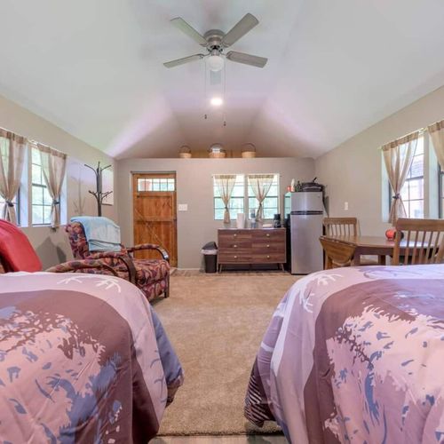 CABIN #2:  Cute little woodsy log cabin with 2 queen-size beds.  Mini-split unit included for heat and A/C.