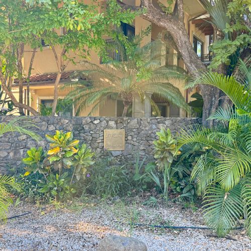 Corner garden at entrance to complex, turn left