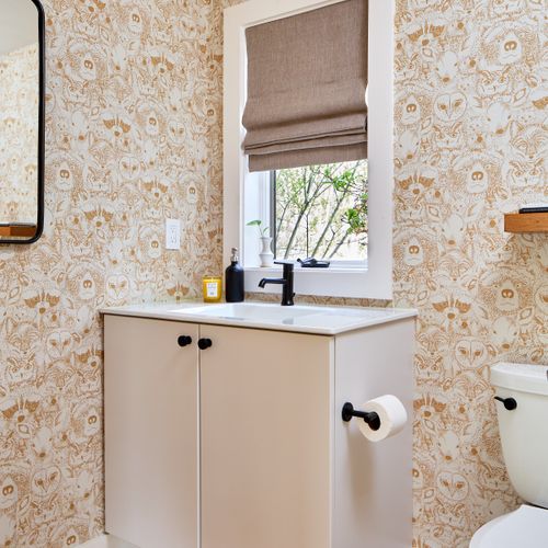 This half bath is on the first floor of the main house, just off the music room.