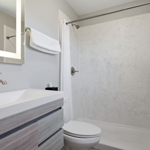 Fresh, well-stocked bathroom ready to refresh & recharge.