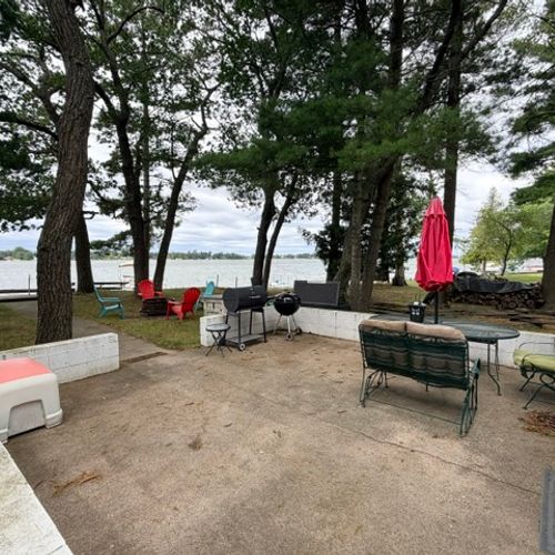 EXTERIOR:  The backyard patio with Van Etten Lake in the background