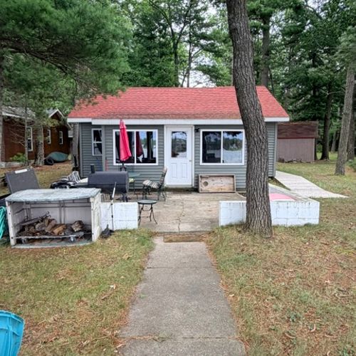 EXTERIOR:  The backyard patio with a charcoal grill and outdoor dining furniture.
