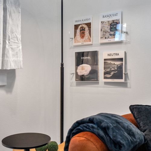 Curated gallery wall & soft lamp light make a cozy corner to unwind