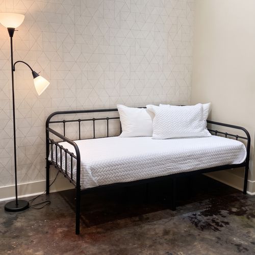Comfortable bed with bedside lighting