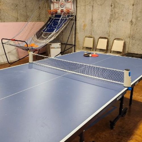 Basement GAME ROOM:  Each reservation includes free use of the game room that is in the basement of the "big house" on the property (where the owners live).