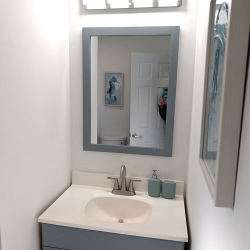 BATHROOM #1 (MAIN FLOOR):  Full bathroom on the main floor that features a wonderfully relaxing rain shower!