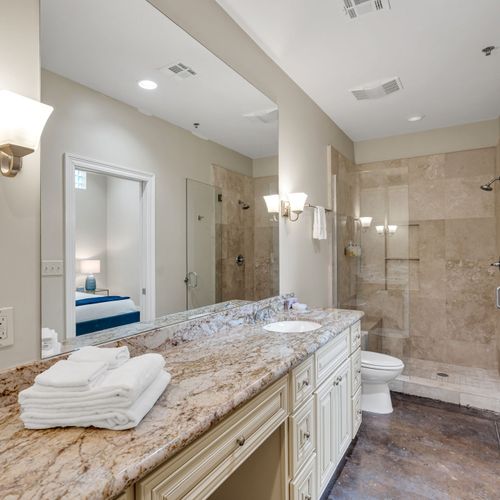Spa-style bath with dual vanity and walk-in shower
