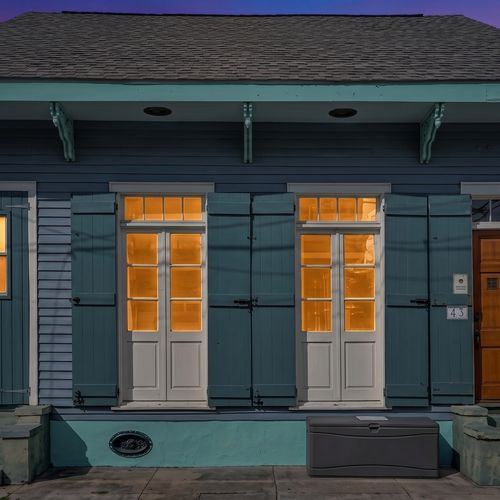 Classic New Orleans façade w/ signature shuttered doors & timeless curb appeal.