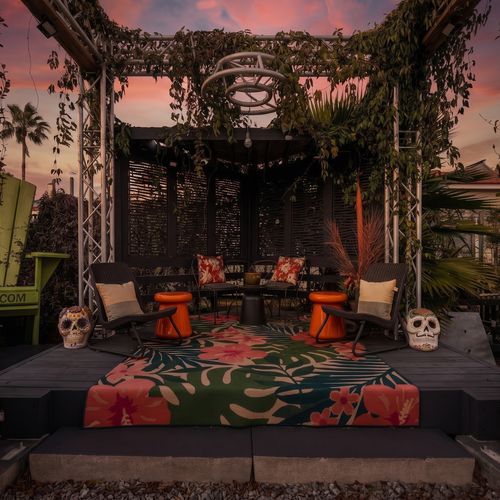 String-lit courtyard perfect for gathering after dark.