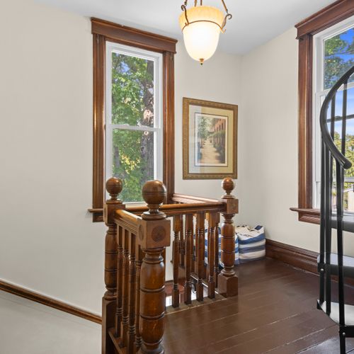 STAIRWAY TO THE TOWER - HOUSE: The circular stairway up to the third floor tower is on the right. May be difficult for elderly individuals, and small children should be cautious with it