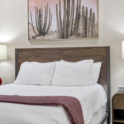 Rustic wood headboard under landscape art