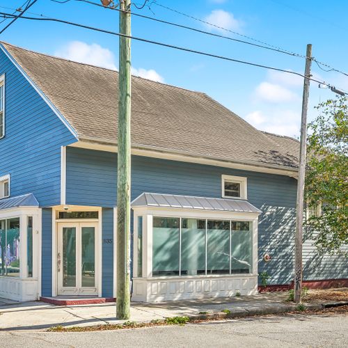 Charming exterior w/ classic architecture & blue siding.