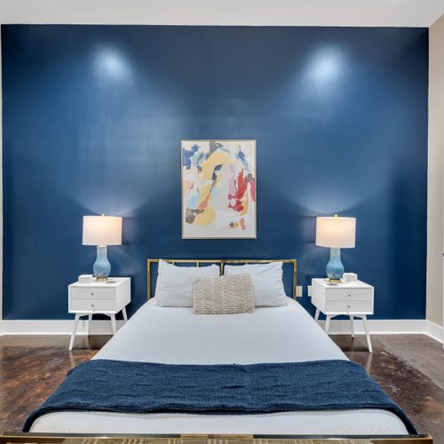 Statement art above a hotel-quality bed