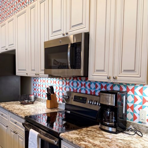 Sleek kitchen with colorful backsplash