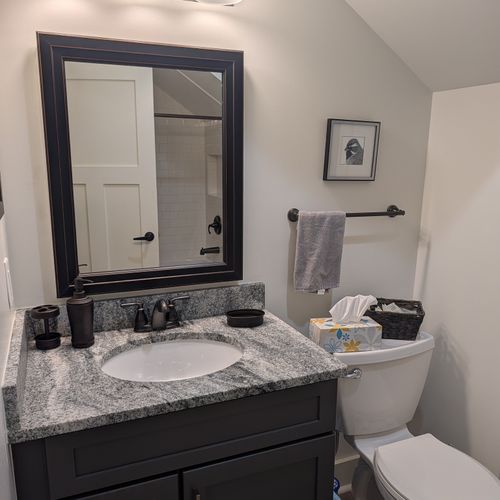 BATHROOM (SECOND FLOOR):  Full bathroom on the second floor with a combination tub and shower.