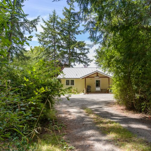 Follow the tree-lined driveway to your private Orcas Island getaway, tucked away in a peaceful forest setting.