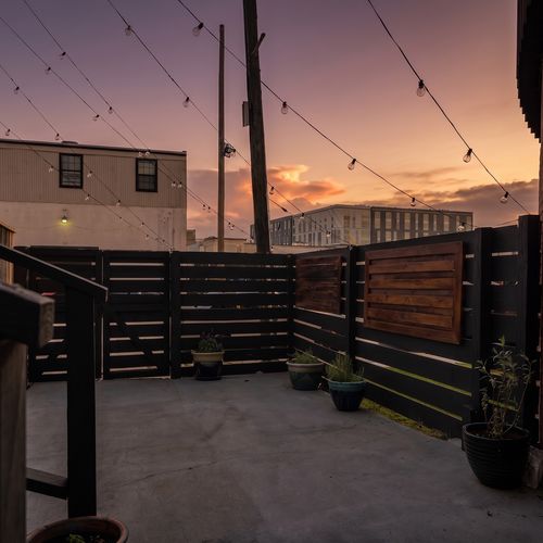 Open-air exterior w/ fenced space offering a private, easy-going outdoor feel.
