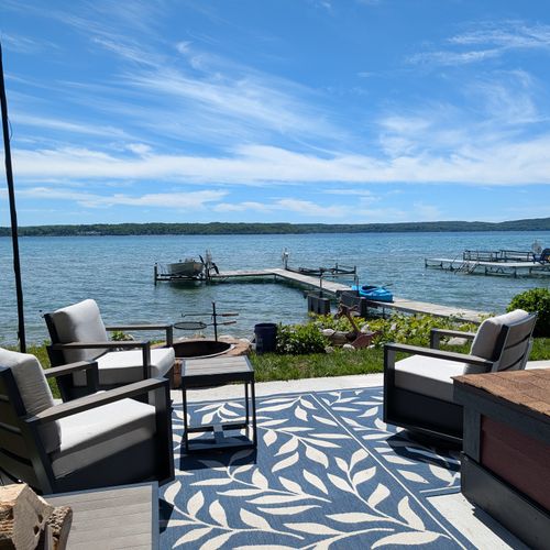 EXTERIOR: The beautiful backyard with lake access to the pristine Crystal Lake. Plenty of seating, a firepit, and kayaks for guest use and enjoyment!