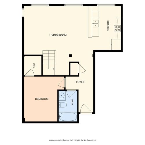 First floor layout with living, kitchen, and laundry
