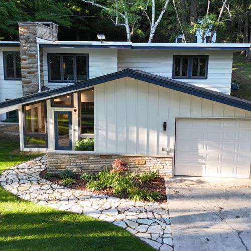 OVERVIEW:  The front of the house in the summer.