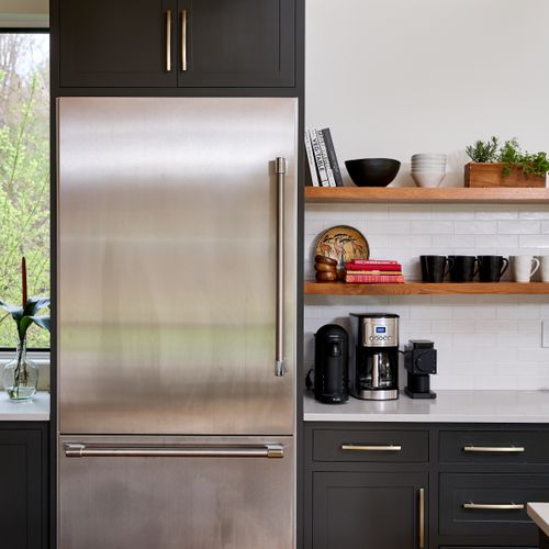 Oversized fridge and coffee station in the main house kitchen.