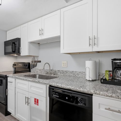 Compact, well-equipped kitchen w/ everything needed for simple meals.