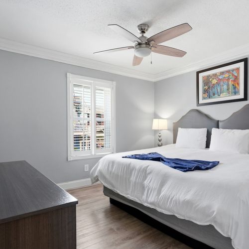 Light-filled bedroom w/ a bed & Smart TV — restful & relaxed.