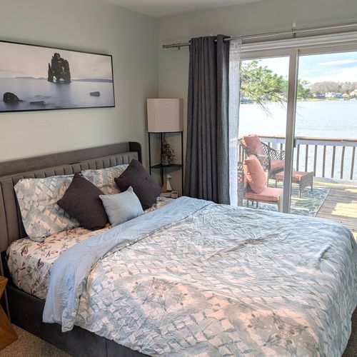 BEDROOM #1 (MAIN FLOOR):  Beautiful bedroom with a great view of Bass Lake, queen-size bed, futon bed, ceiling fan, private television, and private closet.