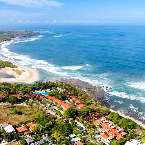 erial daytime view of the beach and coastline near Horizontes Del Mar, Tamarindo