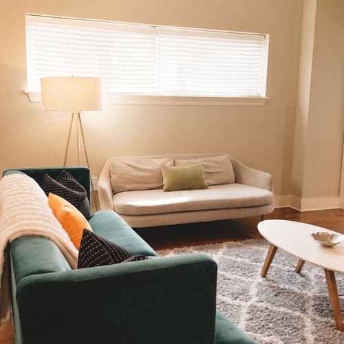Living room w/ comfortable seating & natural light