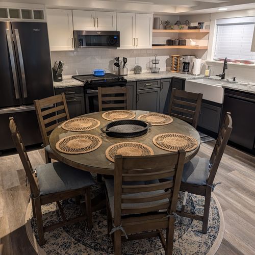 DINING AREA (FIRST FLOOR):  The home has a convenient dining area between the kitchen and living room with a dining table and seating for up to 6 adults.