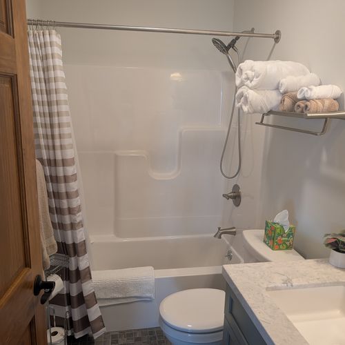 BATHROOM #3 (FIRST FLOOR):  Full bathroom on the first floor with a combination tub and shower.