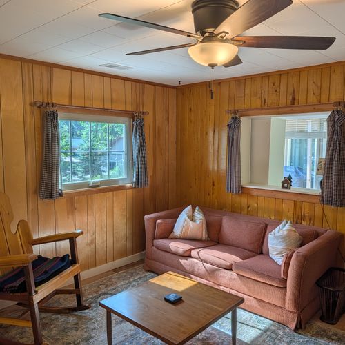 LIVING ROOM:  Cute and cozy living room with a sofa, coffee table, chairs, and a ceiling fan.