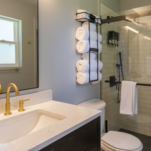 Refresh in a spa-like bathroom with a walk-in shower, plush towels, and complimentary essentials provided