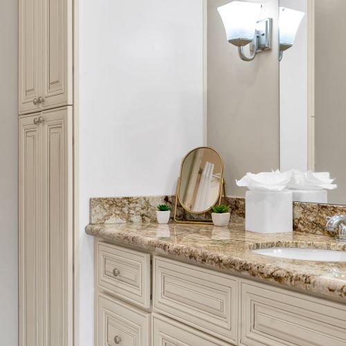 Tissues, towels, and granite at the sink