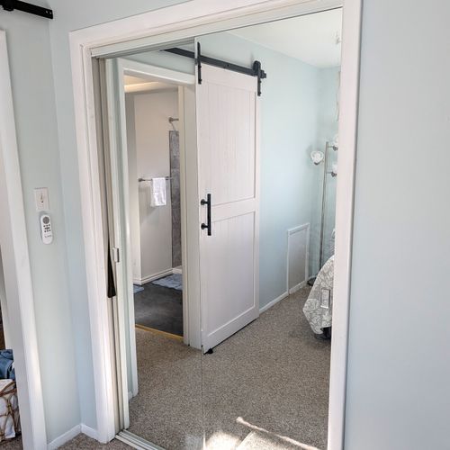 BEDROOM #2 (MAIN FLOOR):  Features a queen-size bed, private desk and chair, and a closet.