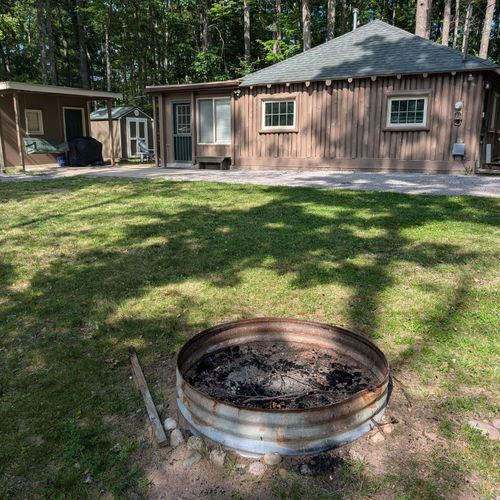 EXTERIOR:  The bonfire ring next to the driveway