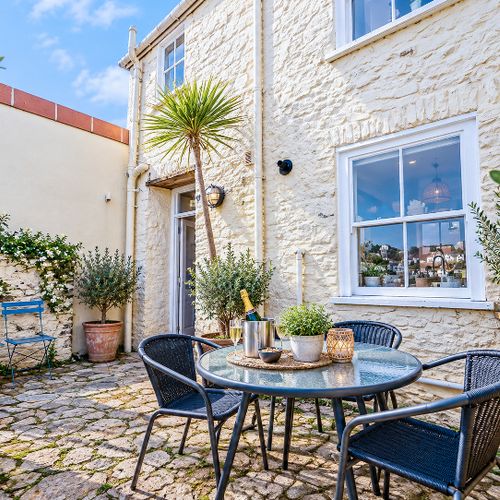 Enclosed courtyard at rear of the property with views over dartmouth.