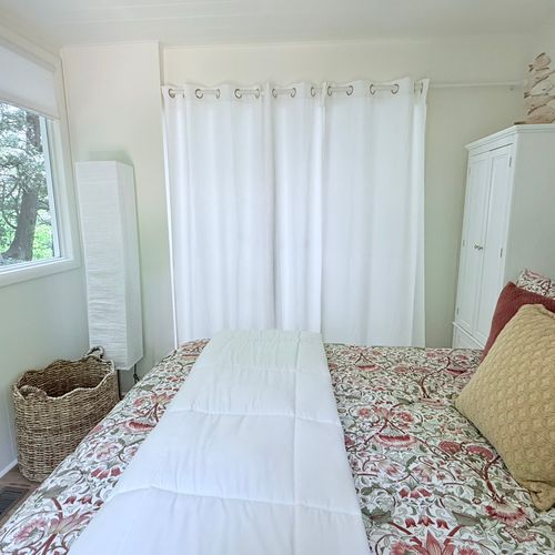 BEDROOM:  The home has a truly gorgeous bedroom with great views of nature, but with blinds on all windows