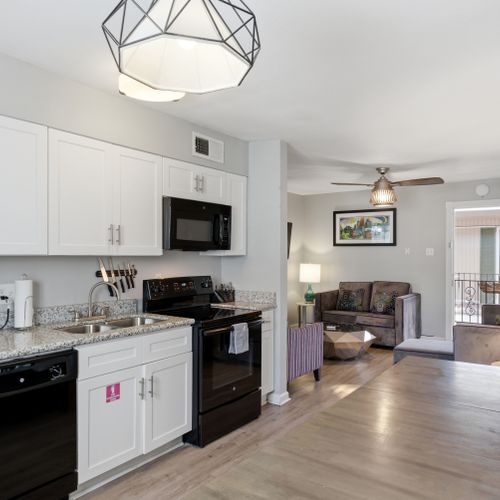 Fully equipped kitchen w/ modern appliances & a dedicated dining space.